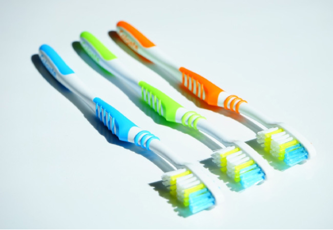 three toothbrushes