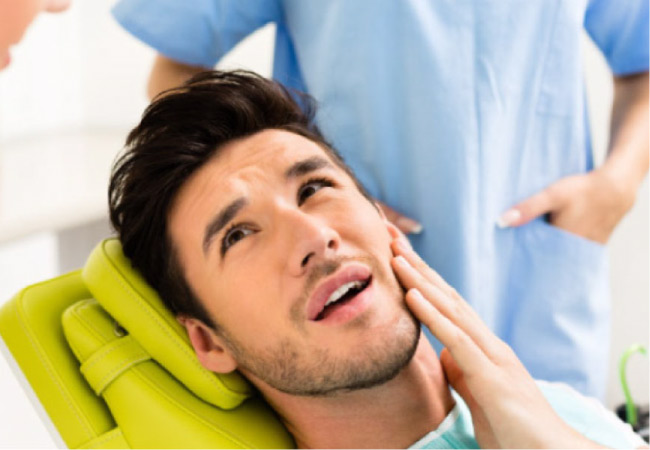 man in the dentist's chair ready for root canal therapy